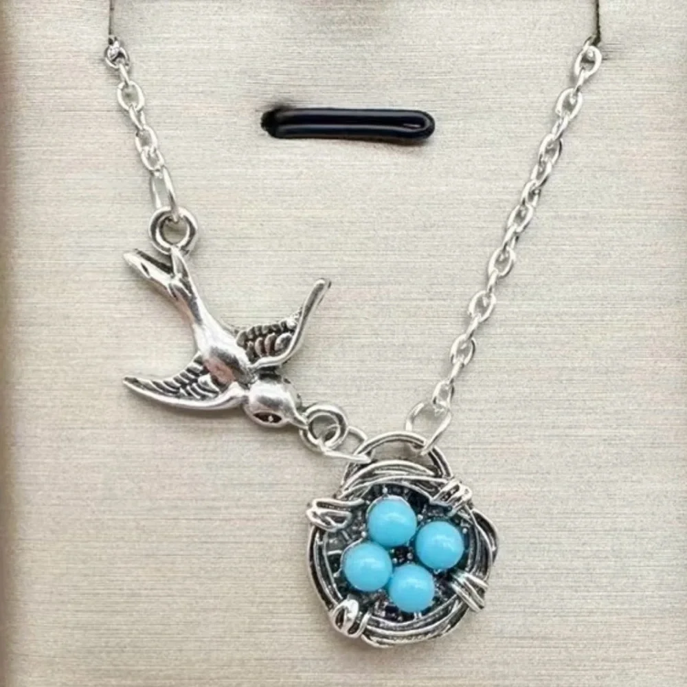 Charming Silver Bird Necklace with Turquoise Accents